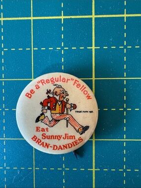Sunny Jim Bran-Dandies Vintage Advertising Pin - White & Red